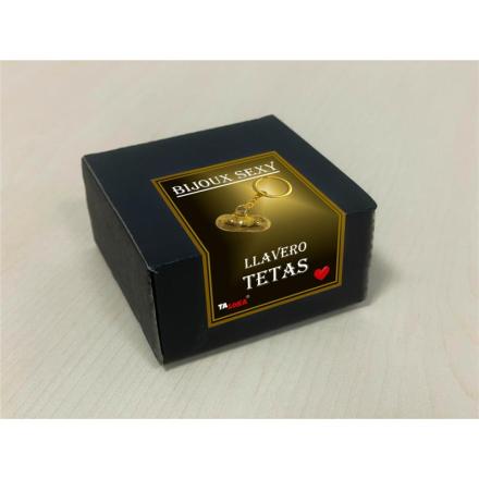 Porta-chaves dourado em forma de peito
